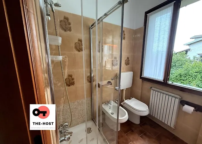 Between Greenery And The Lake, A In *